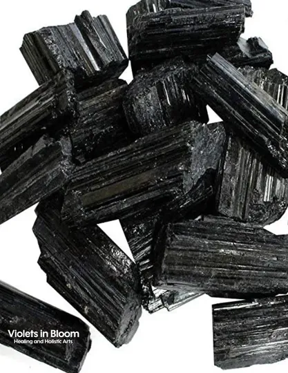 Black tourmaline crystals arranged for a grounding ritual